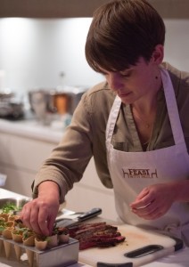 Steak with oyster mayonnaise and rocket canape being assembled